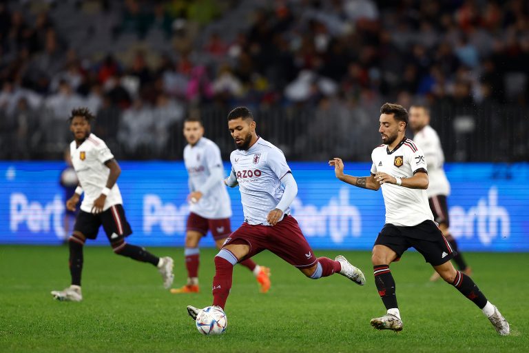Douglas Luiz in action for Aston Villa against Manchester United