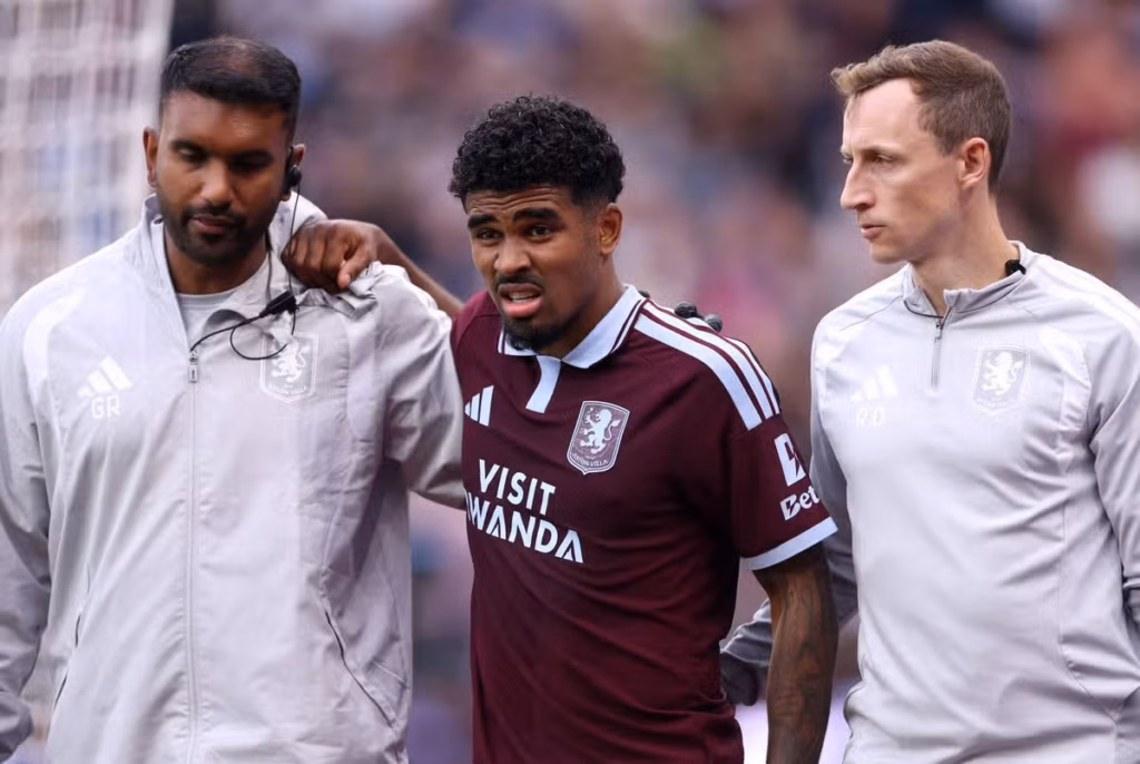 Ian Maatsen receives treatment after suffering an injury for Aston Villa against Nottingham Forest