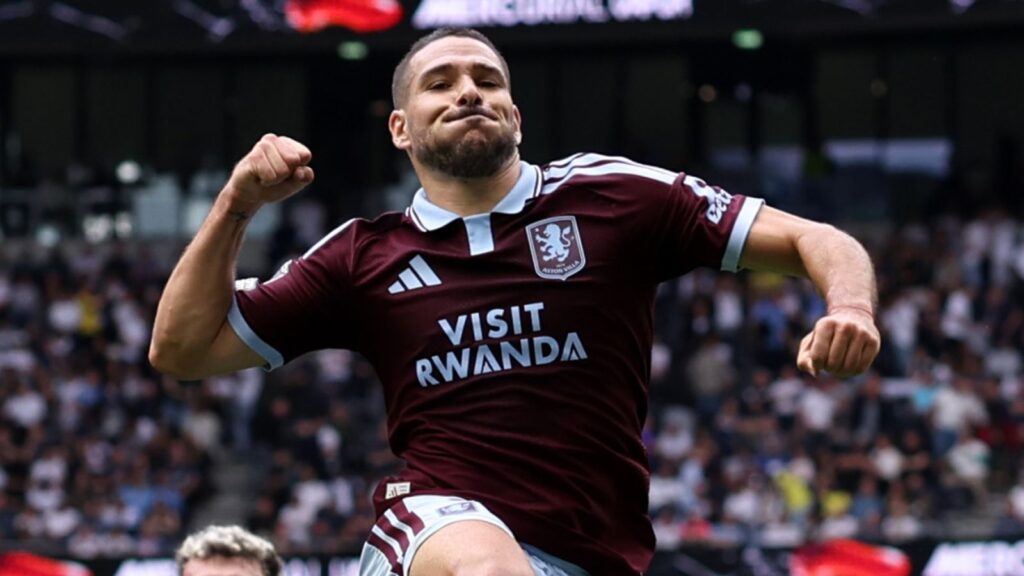 Emi Buendía celebrating in an Aston Villa kit during a match.